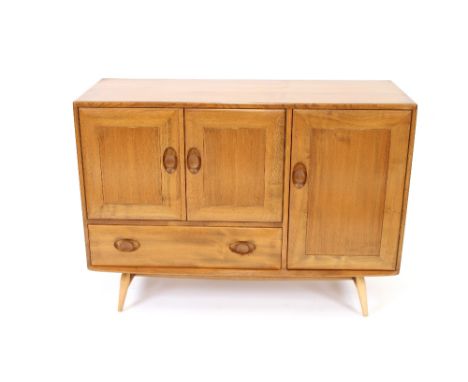 A light Ercol sideboard, fitted cupboards and base drawer, 116cm wide