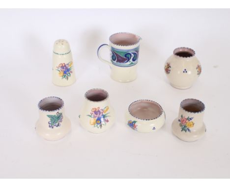 A Poole pottery sugar shaker; a milk jug and various posy vases, (7)

