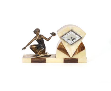 An Art Deco mixed marble mantel clock, decorated with a spelter female holding a dove, Marty clock movement, 29cm high in ext