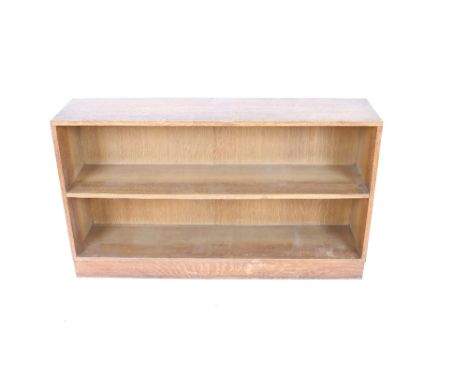 A pair of light oak open fronted two tier bookcases, 106cm wide