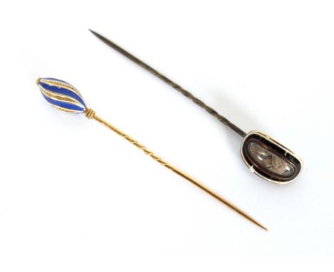 A Victorian yellow metal and enamel memorial stick pin, inset with a plaited hair lock, the reverse inscribed J. Wilson; and 