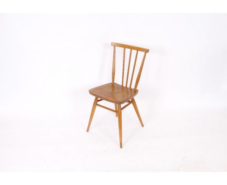 A pair of 1950's Ercol stick back dining chairs