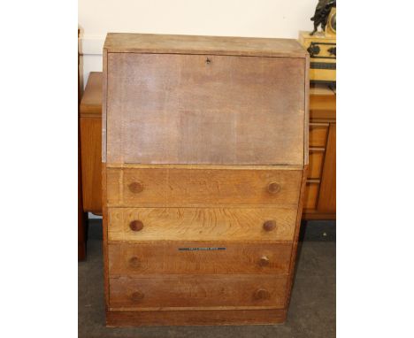 A good quality light oak bureau, fall front opening to reveal an interior of pigeon-holes, four long drawers below, 72cm wide