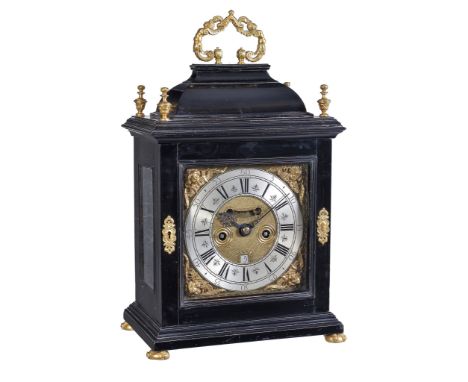 Ω A fine Queen Anne gilt brass mounted ebony table clock with pull-quarter repeat Isaac Papavoine, London, circa 1705-10 The 