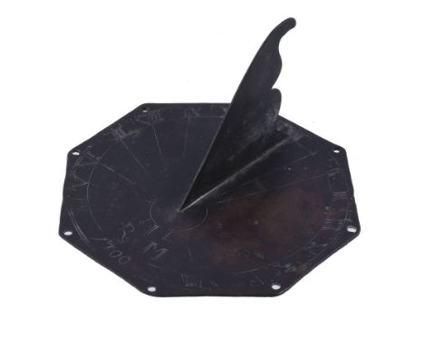  An English patinated brass octagonal sundial Bearing initials I.R.M. and date 1700 but probably earlier  The 6 inch octagona