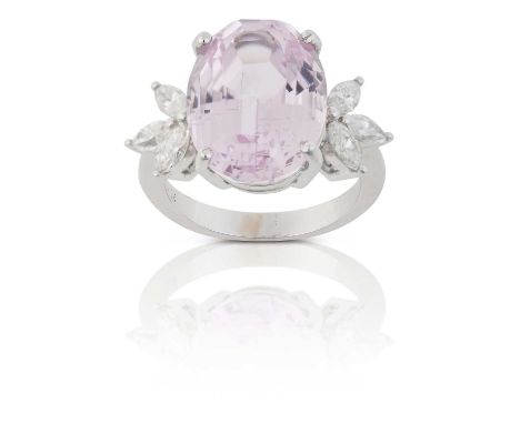 the oval cut kunzite flanked by trios of marquise cut diamonds, in white claw settings, to a tapered shoulder plain polished 