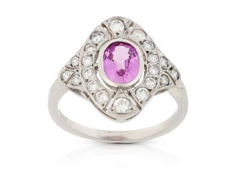 the oval cut pink sapphire within an openwork border of round brilliant cut diamonds, in white millegrain settings, to round 