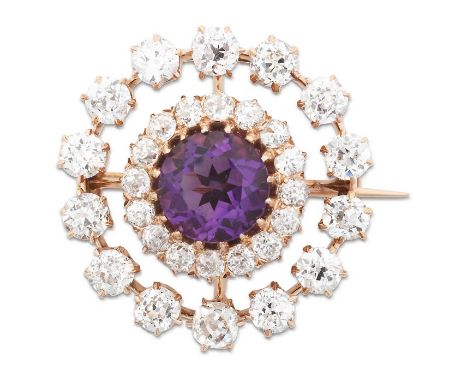 the round cut amethyst within a border of old cut diamonds, to a further openwork border of old cut diamonds, in yellow claw 