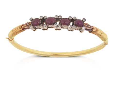 four oval cabochon rubies with round brilliant cut diamonds to four points, in white rubbed over settings, to yellow leaf mot