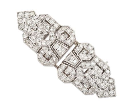 the geometric form inset with baguette cut, old cut and eight-cut diamonds throughout in white claw and rubbed over settings,