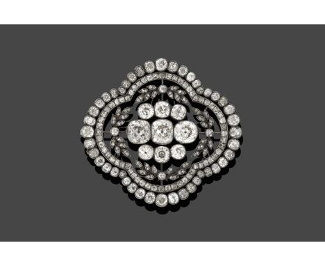 the quatrefoil motif with a cluster of nine old cut diamonds centrally, to an openwork leaf motif border of old cut and rose 
