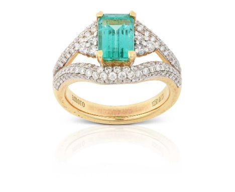 the emerald-cut emerald in a yellow claw setting, flanked by trios of round brilliant cut diamonds in white claw settings, to