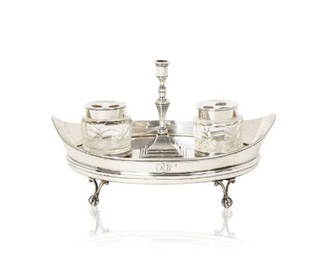 oval and on four ball and claw cast feet, with reeded rim and wood base, with supports for the silver-mounted cut-glass bottl