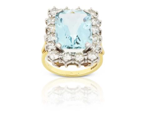 the emerald-mixed cut aquamarine within a border of round brilliant cut diamonds, in white claw settings, to a yellow tapered
