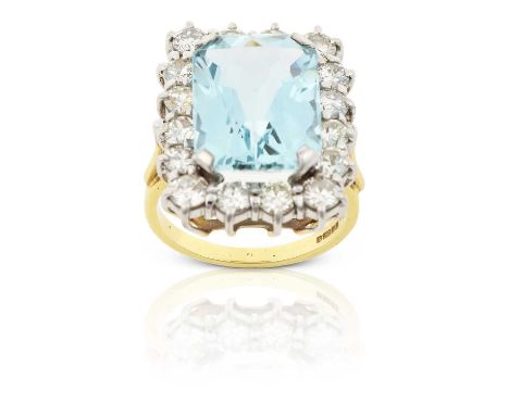 the emerald-mixed cut aquamarine within a border of round brilliant cut diamonds, in white claw settings, to a yellow tapered