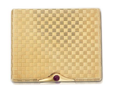 oblong and with basketweave motif, the thumbpiece set with a cabochon ruby, opens to reveal a mirror fitted into the lid, the