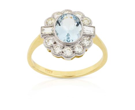 the oval cut aquamarine within a border of round brilliant cut diamonds, with baguette cut diamonds above the shoulders, in w