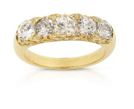 the graduated old cut diamonds with rose cut diamond accents, in yellow claw settings, to a yellow plain polished shank, tota