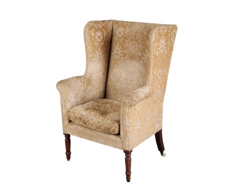 A REGENCY MAHOGANY WING ARMCHAIR early 19th century, with floral pattern cut velvet covers, the square seat on ring turned fr