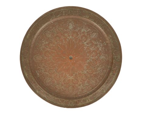 A VICTORIAN COPPER CHARGER with Egyptian Revival style relief decoration, the reverse with attached metal disc inscribed " Sc