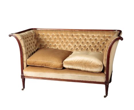 A REGENCY MAHOGANY SOFA early 19th century, with gold velvet button-back covers, the outswept scrolling arms above a square s