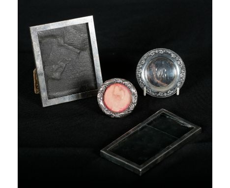 A RAIMOND AMERICAN STERLING SILVER RECTANGULAR PHOTOGRAPH FRAME of plain design, engraved 1963, fabric easel support, 13cm x 