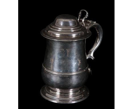 A GEORGE II SILVER TANKARD by Humphrey Payne, London, 1747, baluster form, domed hinged cover with open thumb-piece, double s