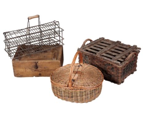 A GROUP OF FOUR VINTAGE CASES including a wicker basket, a wooden egg case, a wire bottle carrier, and a wicker hamper with a