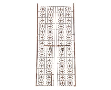 A PAIR OF WROUGHT IRON GATES early 20th century, previously blue-painted, each 186cm high x 40cm wide, not including mounts (