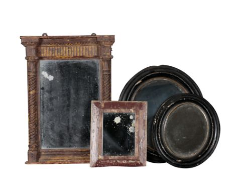 A GROUP OF FOUR MIRRORS including two, 19th century, ebonised oval mirrors, the larger is 36cm high, the other 27cm high, tog