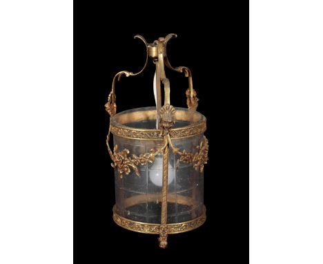 AN ORMOLU AND CUT GLASS CYLINDRICAL HALL LANTERN of 18th Century design, modelled with facemasks and leaf swags, 47cm high x 