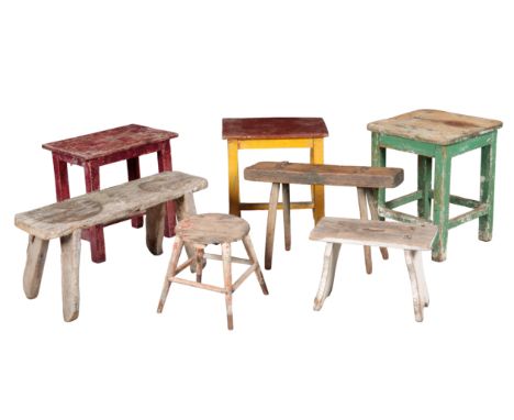 A GROUP OF SEVEN VINTAGE STOOLS of rustic country forms, the tallest 49cm high, the smallest 28cm high (7)Provenance: The Ric