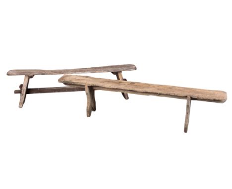 TWO WEATHERED OAK TRESTLE BENCHES the example with a stretcher measuring 45cm high x 165cm wide, the other 44cm high x 184cm 