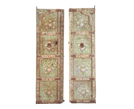 A PAIR OF INDIAN PAINTED DOORS early 20th century, with shaped panelling, and iron mounts and fixings, 170cm x 47cm (2)Proven