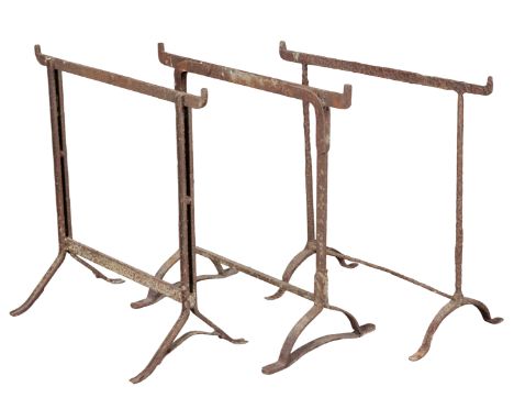 THREE IRON TRESTLES 19th century, the tallest 77cm high, the shortest 75cm high (3)Provenance: The Richard Pratley Collection