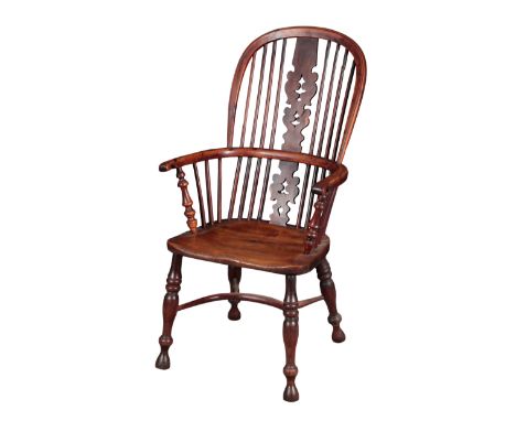 AN ELM AND YEW WINDSOR CHAIR 19th century, the hoop back with shaped and pierced central splat, on turned legs joined by crin