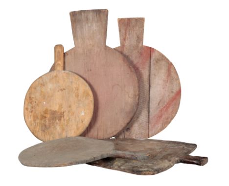 A GROUP OF FIVE RUSTIC CHOPPING BOARDS the largest 65cm x 47cm, the smallest 49cm x 35cm (5)Provenance: The Richard Pratley C