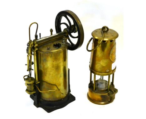 Live Steam Engine with brass vertical boiler, side mounted fixed cylinder and single flywheel with curved spokes; opening doo