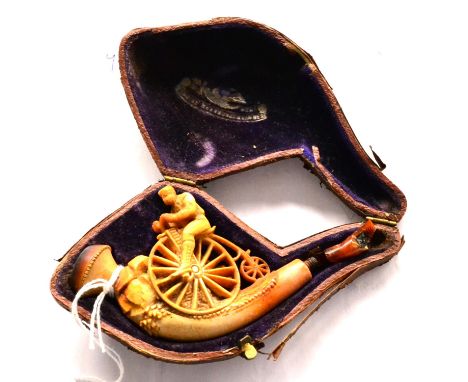A Meerschaum Pipe or Cheroot Holder in the Form of a Man on a Penny Farthing Bicycle, in original fitted case (stem broken)