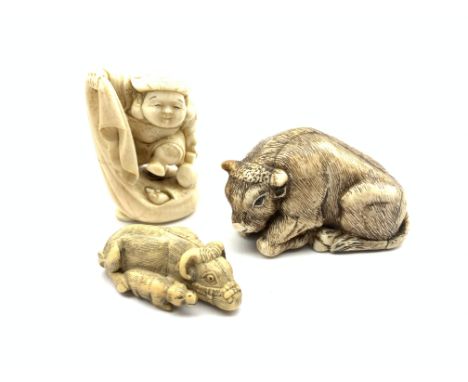 Japanese ivory netsuke in the form of an Okimono with signature mark and two others in the form of water buffalo  Condition R