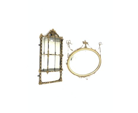 19th century gilt wood and gesso regency design oval wall mirror, with urn finial flaked by bell husks and ribbon swags, (W88