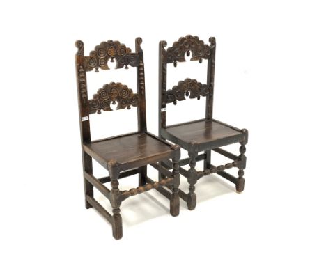 18th century and later Derbyshire carved oak country side chair, with two carved arched panels above plank seat, raised on bo