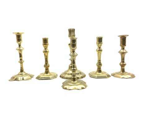 Pair of mid 18th Century brass candlesticks with octagonal bases H19cm, three other 18th Century candlesticks and a Continent