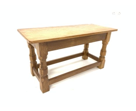 Robert Thompson of Kilburn Yorkshire oak occasional table, rectangular adzed top raised on octagonal supports united by stret