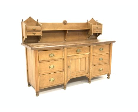 Edwardian pine sideboard dresser, raised back with open shelf and four drawers, seven drawers and cupboard under, raised on t