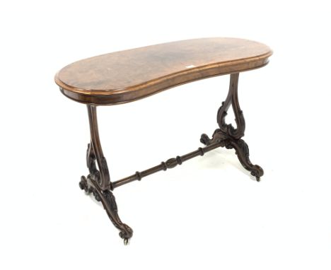 Victorian walnut kidney shape centre table, burr top with moulded edge above pierced and scroll carved end supports, united b