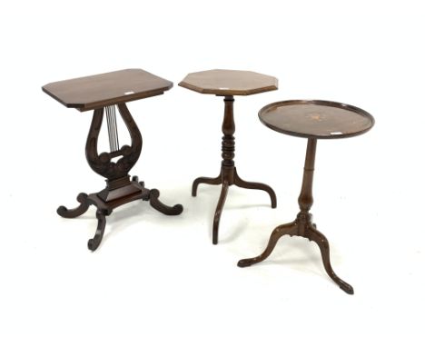 Regency design walnut occasional table, octagonal top raised on lyre shaped and carved pedestal, platform base, four splayed 