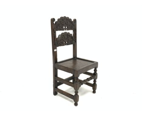 18th century Derbyshire oak side chair, with two scroll carved arched panels to back enclosed by applied split turned pilaste