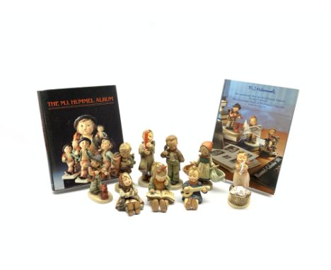 Nine Hummel Goebel figures including 'Wash Day', 'Puppy Love', 'Candelight', H17cm and six others and two books relating to H