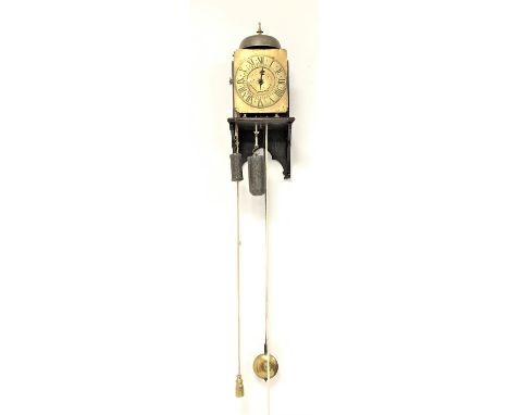 17th century design lantern clock, with brass dial, single hour hand, Roman numeral chapter ring, mounted on a oak wall brack